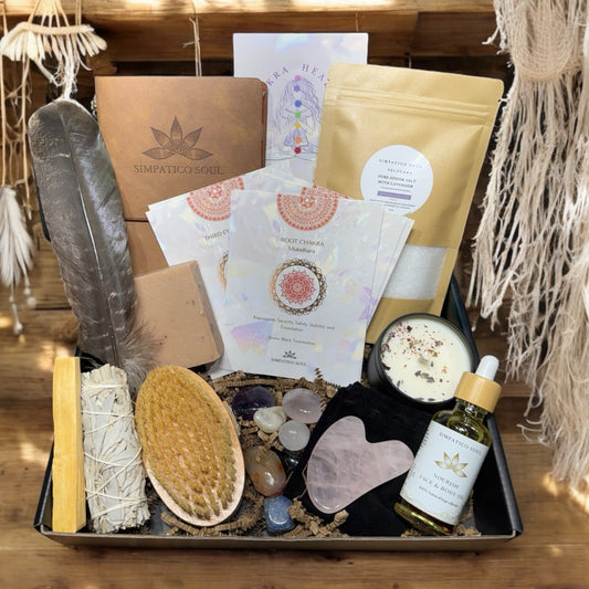 Self-care ritual set featuring a leather journal, chakra crystals, healing cards, natural dry brush, rose quartz gua sha tool, natural face and body oil, handmade bar soap, smudging set and a lavender candle. Perfect for chakra healing, holistic skincare, mindfulness, and stress relief. A thoughtful wellness gift for women, busy moms, or anyone seeking daily rituals for self-love, energy balance, and relaxation. Made in California using clean, nontoxic and organic ingredients.