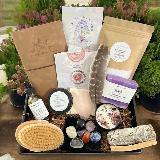 Self-care ritual set featuring a leather journal, chakra crystals, healing cards, natural dry brush, rose quartz gua sha tool, natural face and body oil, handmade bar soap, smudging set and a lavender candle. Perfect for chakra healing, holistic skincare, mindfulness, and stress relief. A thoughtful wellness gift for women, busy moms, or anyone seeking daily rituals for self-love, energy balance, and relaxation. Made in California using clean, nontoxic and organic ingredients.